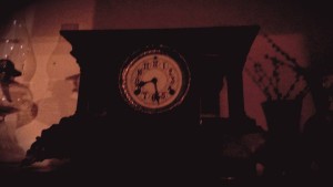 The parlor clock, stopped at 8:29.